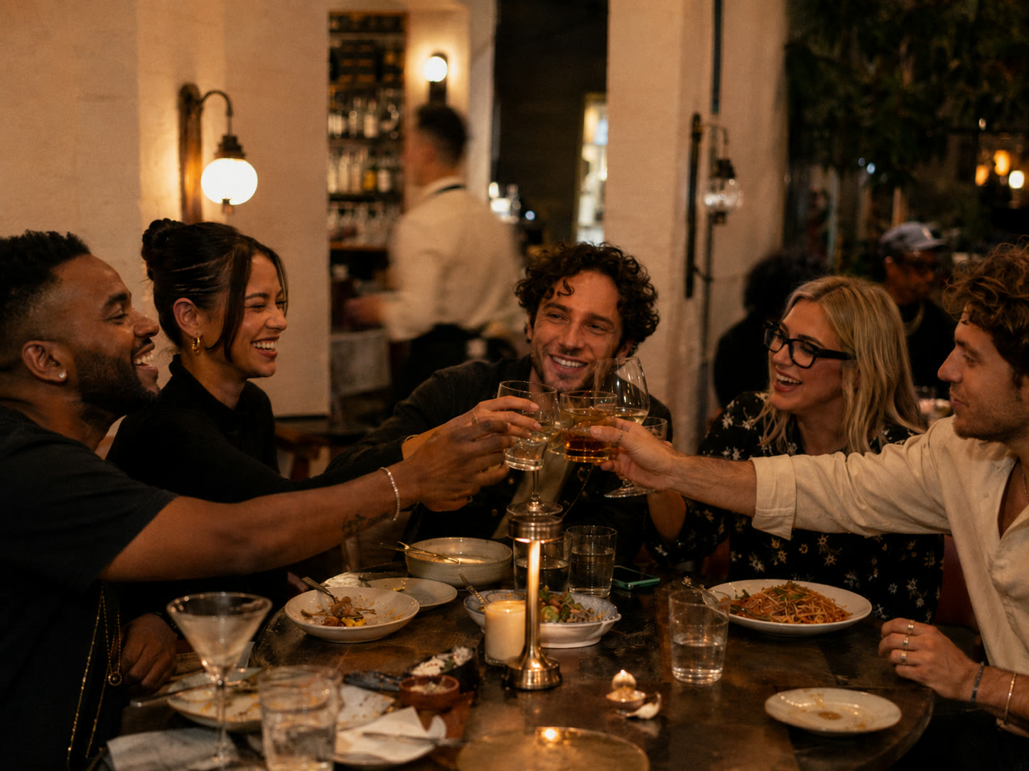 Music industry team gathering around a table